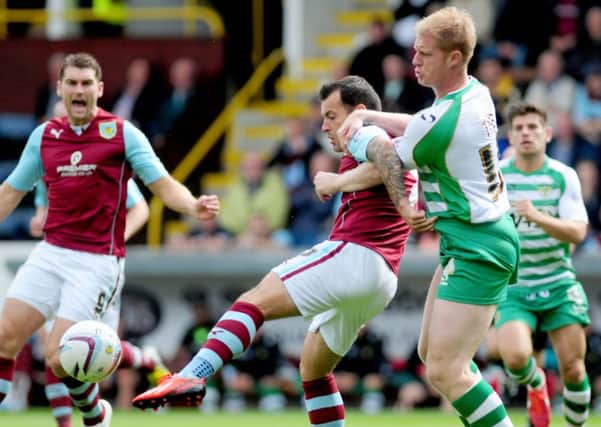 BURNLEY V VEOVIL TOWN: Ross Wallace under pressure from Tate.
Photo Ben Parsons