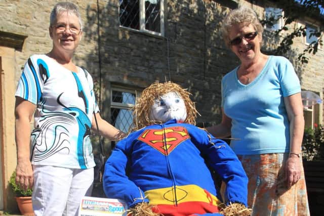 Florence Farrar and Dorothy McQuade with Superman at the Higham Scarecrow Festival.