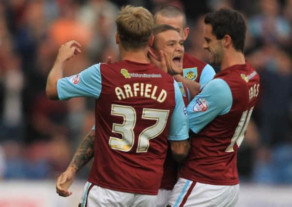 Kieran Trippier celebrates his goal with Scott Arfield and Danny Ings