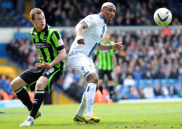 27th April 2013. Leeds United v Brighton and Hove Albion. Leeds's El-Hadji Diouf takes on Brighton's Ashley Barnes.