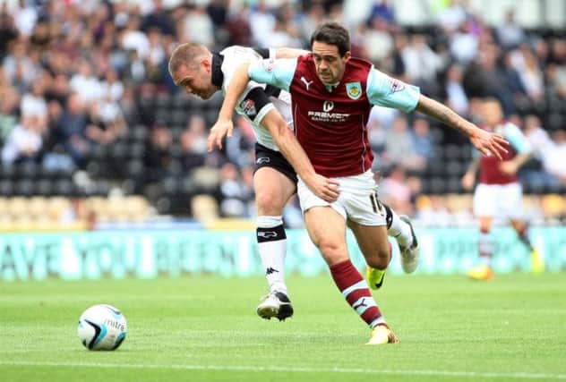 SOLO GOAL: Danny Ings races past Jake Buxton on his way to opening the scoring at Derby on Saturday