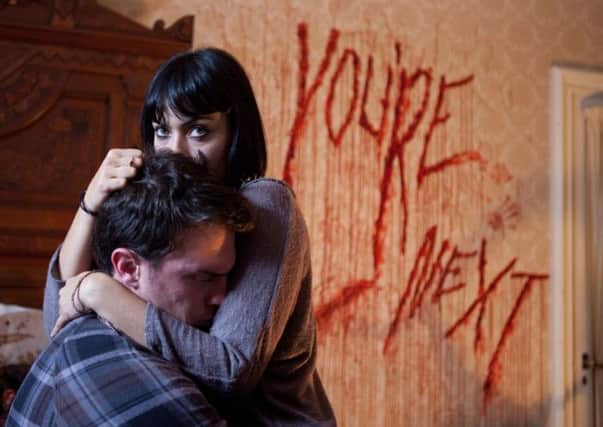 Undated Film Still Handout from You're Next. Pictured: WENDY GLENN as Zee and NICHOLAS TUCCI as Felix. See PA Feature FILM Film Reviews. Picture credit should read: PA Photo/Lionsgate. WARNING: This picture must only be used to accompany PA Feature FILM Film Reviews.