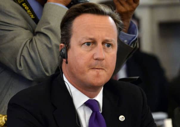 Prime Minister David Cameron listens to comments during a working session at a G-20 summit in St Petersburg, Russia, discussing Syria's civil war. (AP Photo/Dimitar Dilkoff, Pool)