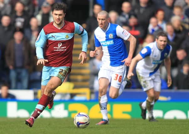 In opposition David Jones challenges Charlie Austin in the derby at Ewood Park in March