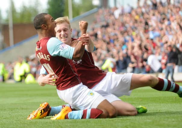 Brilliant strike: Ben Mee celebrates with Junior Stanialss after the winger fired Burnley ahead.