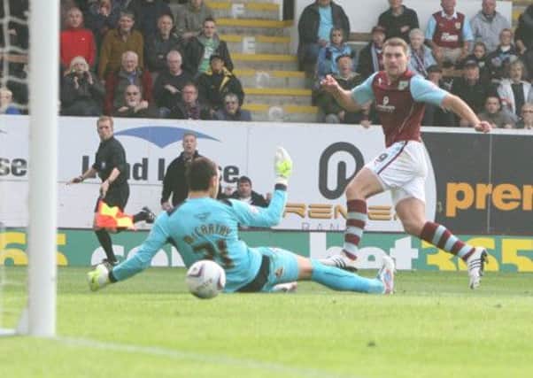 Sam Vokes slots the ball home for the second goal.