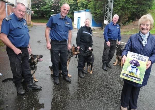 PC Jon Willan and PD Lex, PC Roger Moore and PD Lapo, PC Sarah Sapey and PD Kira and PC Duncan Brammar with PD Abby and Hazel Lansdell at the launch of the 2014 Police Dogs Calendar.
