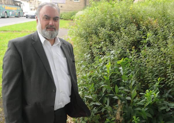Coun. Hanif at one of the areas in Brierfield that he would like to transformed into flower beds.