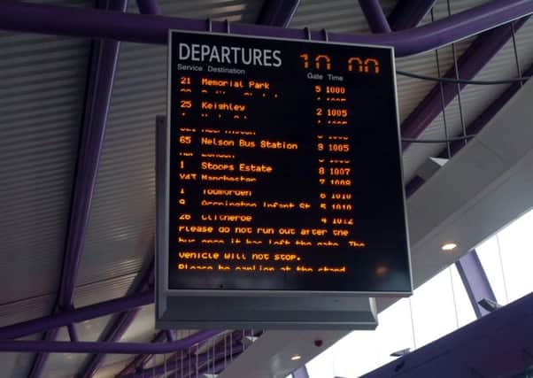 Electronic bus timetables in Burnley Bus Station. 
Photo Ben Parsons