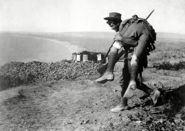 Photo by REX/Courtesy Everett Collection (3001762a) 
An Australian soldier carrying a wounded comrade during World War I.