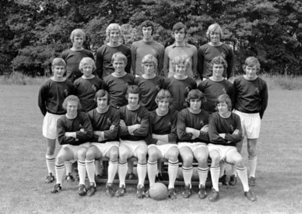 Glory year: The Burnley class of 1972/73 that went on to win the Second Division title, with QPR finishing  as runners-up. Dave Thomas, transferred to Rangers in October 1972, is pictured second right, middle row