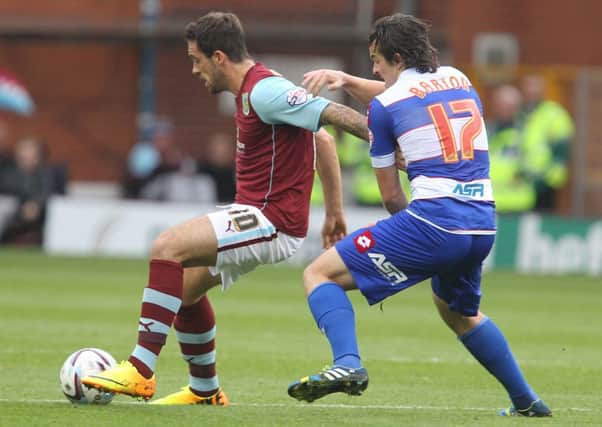 Danny Ings battles for the ball with Joey Barton