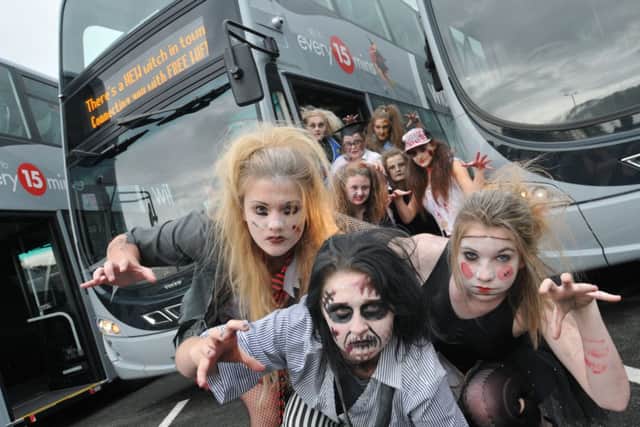Hayley Bretherton (15), Polly Whitcombe (15) and Millie Clery (14) with dancers at the launch of the new Witch Way bus fleet at Nelson & Colne College.