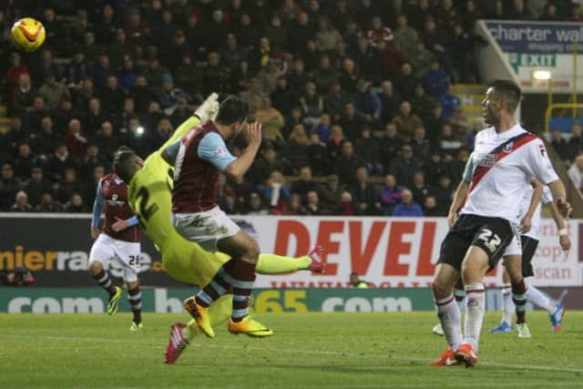 Danny Ings beats Lee Camp to the ball to bring Burnley level.