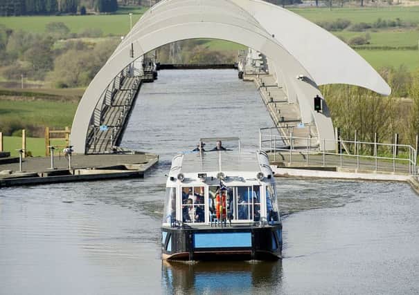 Falkirk Wheel and boat and inset the Macdonald Inchyra Hotel and Spa