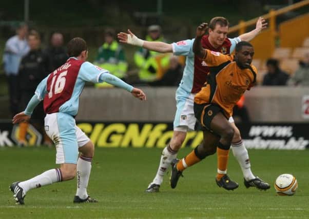 Prolific pairing: Sylvan Ebanks-Blake, pictured taking on Steve Caldwell five years ago, netted 25 goals and Chris Iwelumo 16 as Wolves were promoted to the Premier League