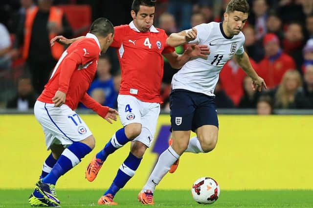 England's Jay Rodriguez (right) and Chile's Mauricio Isla battle for the ball during the International Friendly at Wembley Stadium, London. PRESS ASSOCIATION Photo. Picture date: Friday November 15, 2013. See PA story SOCCER England. Photo credit should read: Nick Potts/PA Wire. RESTRICTIONS: Use subject to FA restrictions. Editorial use only. Commercial use only with prior written consent of the FA. No editing except cropping. Call +44 (0)1158 447447 for further information.