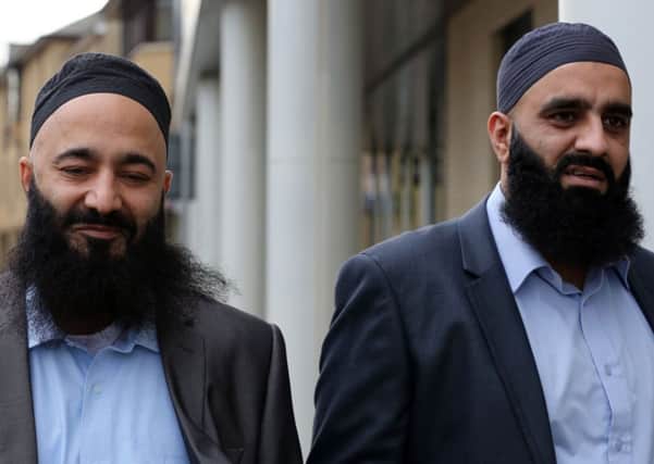 Mohammed Safdar (left) and Tayyab Subhani (right) leave Chelmsford Crown Court, Essex, where they are charged with endangering the safety of an aircraft.  PRESS ASSOCIATION Photo. Picture date: Tuesday November 12, 2013. See PA story COURTS Plane. Photo credit should read: Chris Radburn/PA Wire
