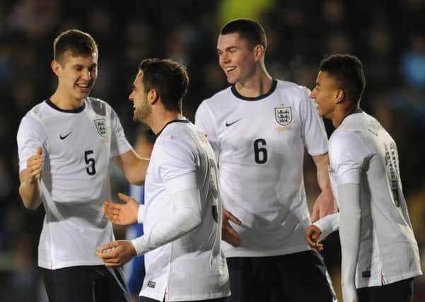 TWO GOOD: Englands Danny Ings celebrates scoring the sixth goal with John Stones (left)