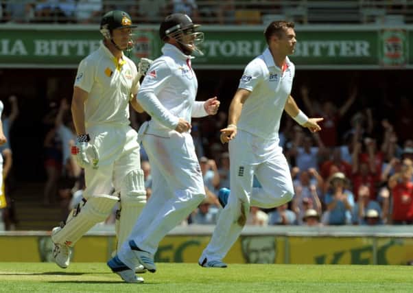England's James Anderson (right) celebrates taking the wicket of Australia's George Bailey (left) during day one of the first Ashes Test at The Gabba, Brisbane, Australia