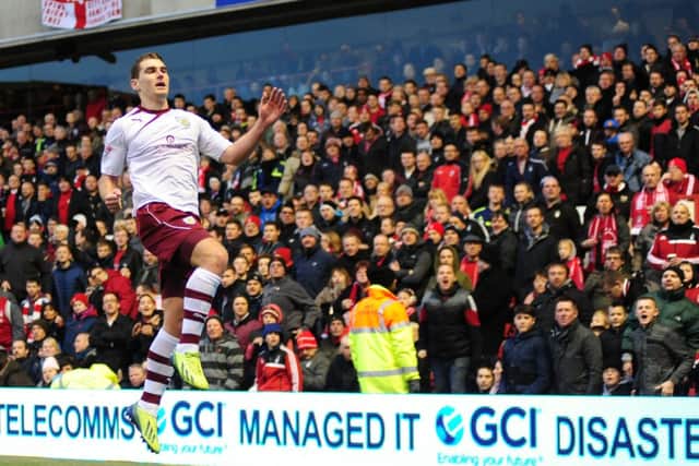Sam Vokes celebrates putting the Clarets ahead from the spot