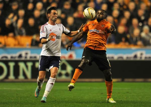 Free agent: Sylvan Ebanks-Blake, pictured taking on former Claret Chris Eagles, has been linked with a move to Turf Moor
