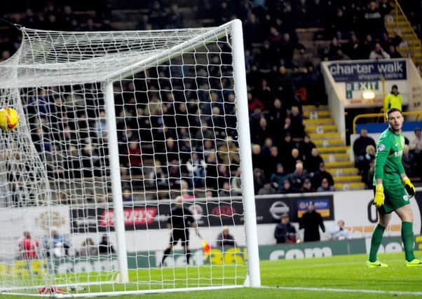 No chance: Barnsley keeper Jack Butland is left rooted by Michael Kightlys goal on Saturday