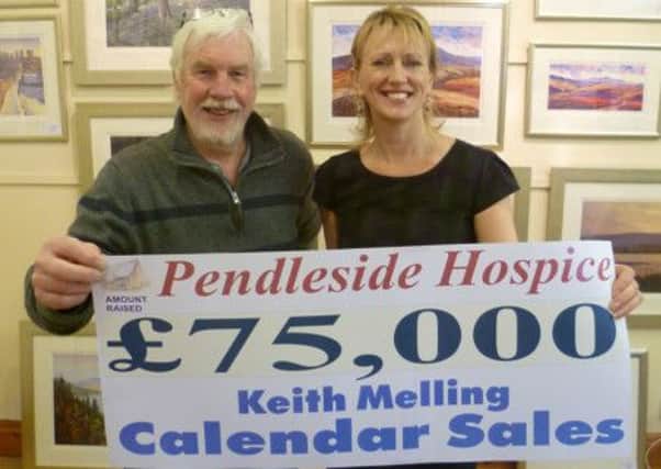 SALES: Artist Keith Melling who has raised £75,000 from his calendars, with hospice fund-raising manager Christine Cope