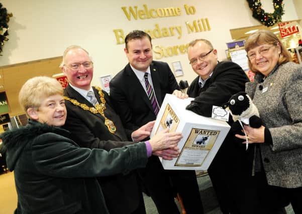 Maureen McDermott and Ann Lang from the Good Shephard Parish with the Mayor of Pendle Coun. Smith Benson, MP Andrew Stephenson and Council Leader Joe Cooney draw the winning ticket from the Sheep Trail in Boundary Mill. 
Photo Ben Parsons