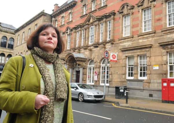 Leader of Burnley Council Coun. Julie Cooper outside the Post office on Hargreaves Street which is due to close.
