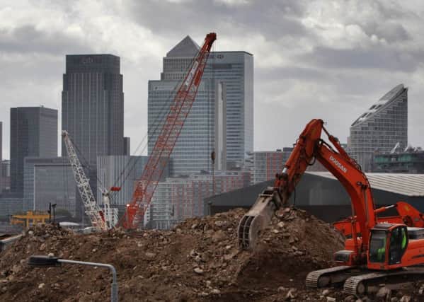 work being carried out in front of Canary Wharf in east London. Photo: Lewis Whyld/PA Wire