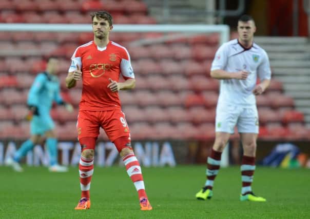Old boy: Former Claret Jay Rodriguez is closely watched by Kevin Long at St Marys on Saturday