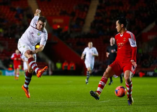 New deal: Sam Vokes gets a shot away at Southampton on Saturday, before agreeing a new contract with Burnley on Monday