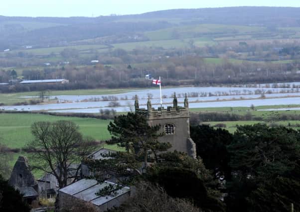 Flooding in rural areas.
Flooded land around Warton, near Carnforth.
St Oswald's Church Warton in foreground.