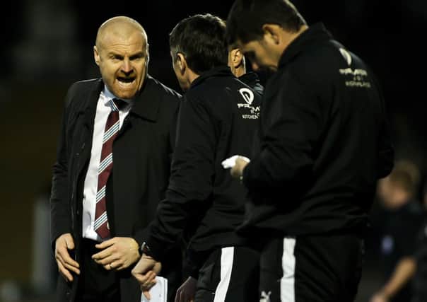 Sean Dyche discusses tactics with his staff during the victory over Yeovil Town