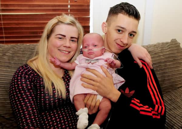 Adele Morrell and Lewis Turner with their baby daughter Isabella.
Photo Ben Parsons