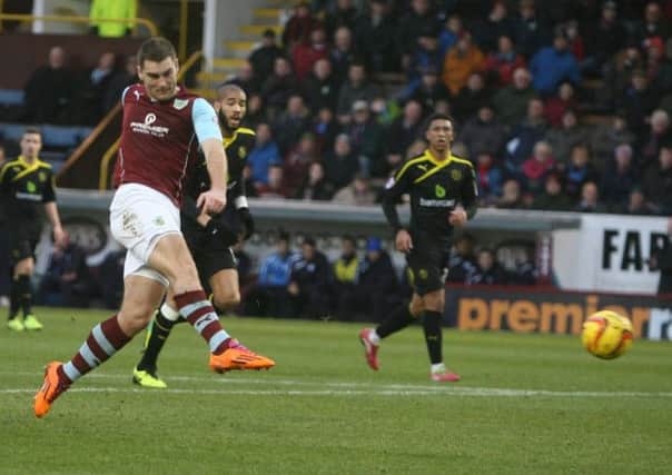 Sam Vokes fires Burnley into the lead.