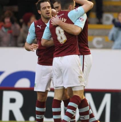 Sam Vokes celebrates his goal with Danny Ings and Dean Marney.