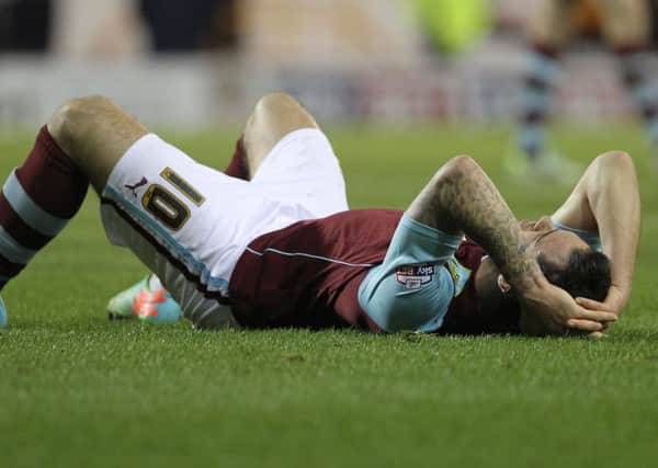Down, but not out: Striker Danny Ings shows his frustration after the 1-1 draw at Turf Moor against Sheffield Wednesday on Saturday