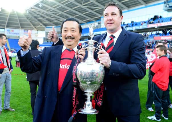 Championship winner: Vincent Tan with former Cardiff City boss Malky Mackay in May