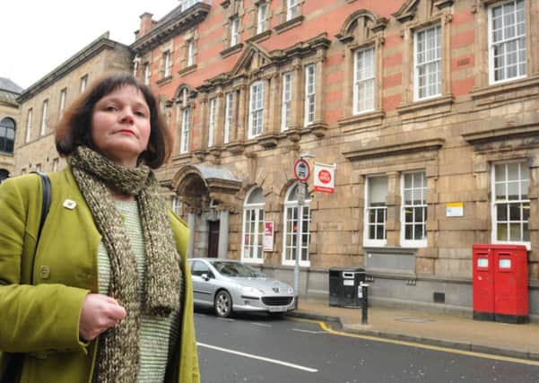 Leader of Burnley Council Coun. Julie Cooper outside the Post office on Hargreaves Street which is due to close.