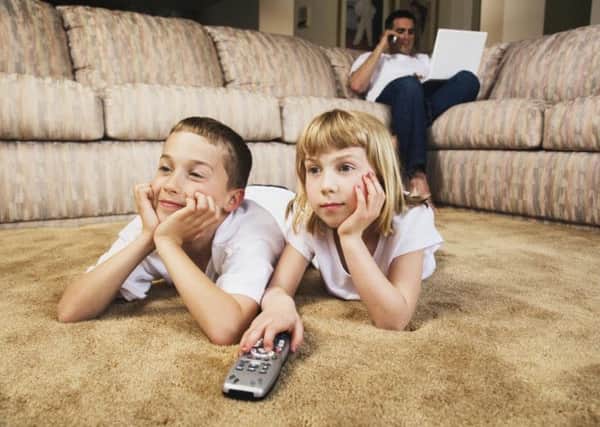 children watching television.