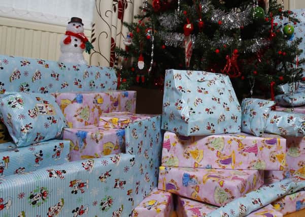 Christmas presents under a tree. Photo: Peter Byrne/PA Wire