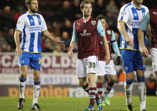 Signed: Ashley Barnes in action against his former team Brighton