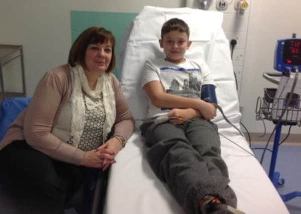 The first patient through the doors at Burnley General Hospital's urgent care centre Harry Wintersgill from Barrowford with his mum Tracy (s).