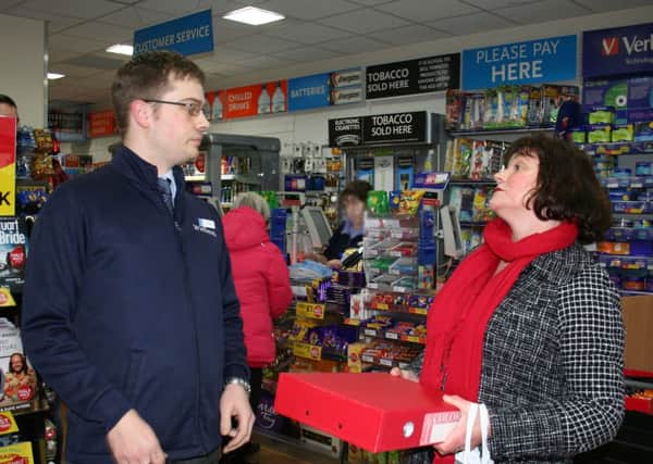 POST OFF: Burnley Council Julie Cooper tries to hand over a petition to the Burnley WH Smith manager