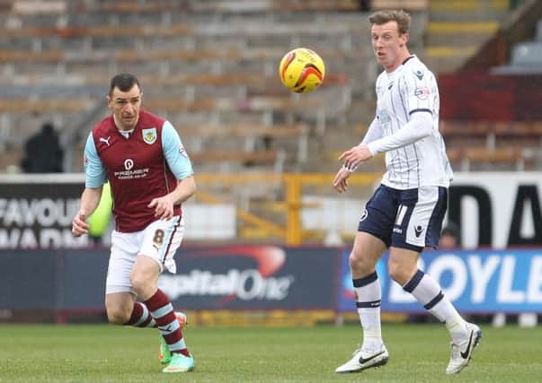 Unsung hero: Dean Marney clears the danger against Millwall on Saturday
