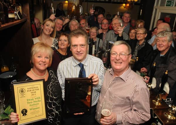 CAMRA National Chairman Colin Valentine (centre) with Christine and Stephen Dilworth at the presentation of the National CAMRA Pub of the Year award.
