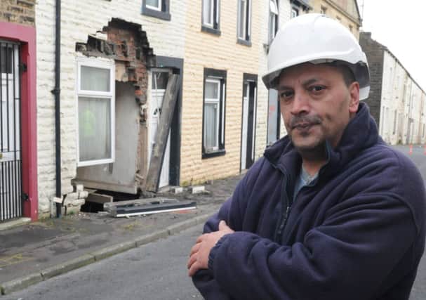 John Rhodes who lives next door to the collapsed house on Herbert Street.