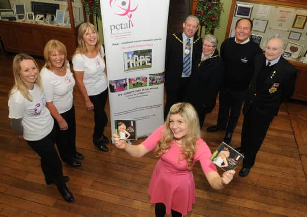 Grace O'Malley with her new charity cd in aid of Petal along with Jenny Murgatoryd, Karen Weaving, Karen Mendoros, Mayor and Mayoress of Padiham, Coun. Vince Pridden and Mrs Gillian Pridden, Dennis Mendoros and Ted Davidson.